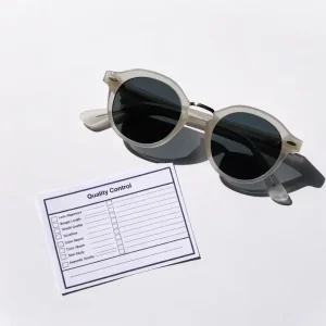 Quality sunglasses manufacturing — acetate frame production and QC inspection at a Shenzhen OEM eyewear factory