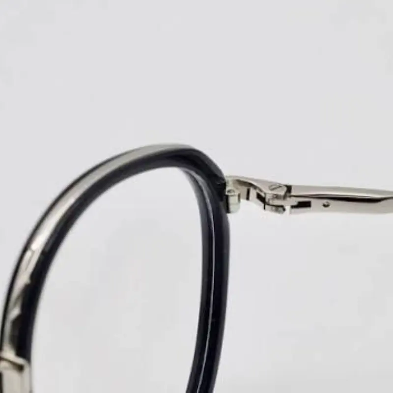 Sunglasses hinge construction detail — barrel hinge and spring hinge comparison showing quality differences in eyewear manufacturing