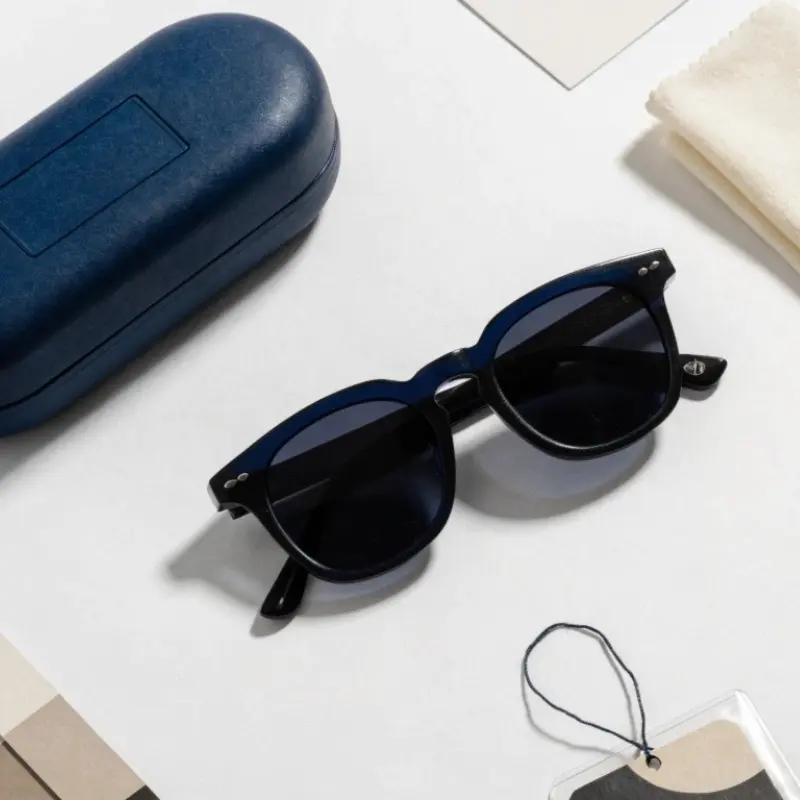 private label eyewear OEM China — custom logo acetate sunglasses with branded case cleaning cloth and hang tag showing flexible MOQ development