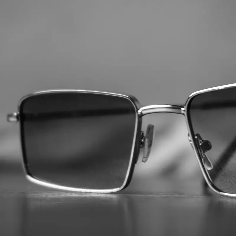 Titanium sunglasses finishing options side by side — brushed, PVD-coated, and polished surface treatments